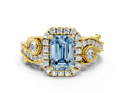 Yellow gold Fancy Blue Emerald Cut Halo Diamond Ring with Milgrain and Bezel Accents on a Split Shank Band