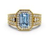 Yellow gold Fancy Blue Emerald Cut Halo Diamond Split Shank Ring with Prong Setting