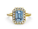 Yellow gold Fancy Blue Emerald Cut Halo Round Diamond Solitaire Ring with Pavé Band and Four-Prong Setting