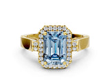 Yellow gold Fancy Blue Emerald Cut Halo Round Diamond Twist Band with Four-Prong Setting