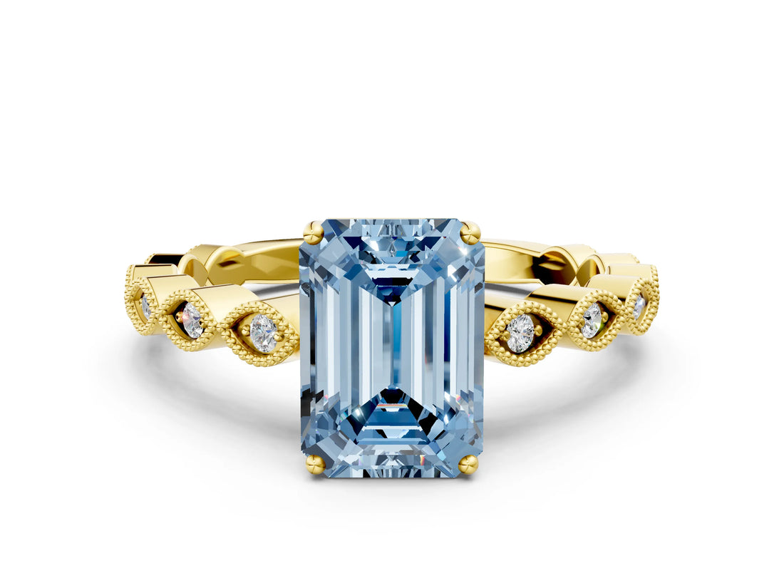 Yellow gold Fancy Blue Emerald Cut Solitaire Diamond Ring with Infinity Twist Band and Four-Prong Setting