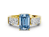 Yellow gold Fancy Blue Emerald Cut Solitaire Princess Side Stone Engraved Band Prong Setting Ring