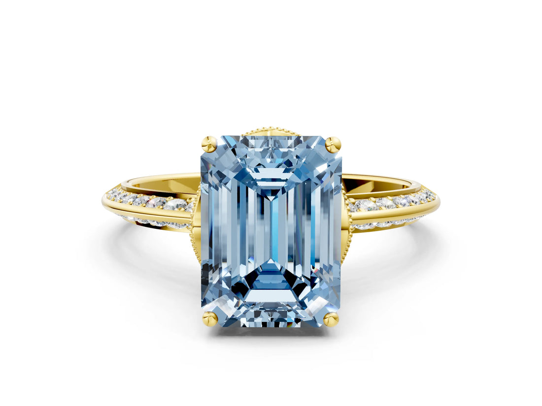 Yellow gold Fancy Blue Emerald Cut Solitaire Split Shank Pave Diamond Engagement Ring with Four-Prong Setting