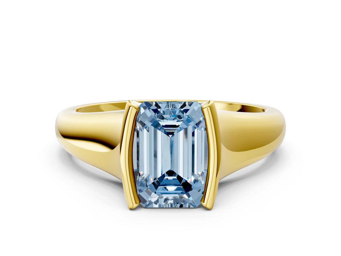 Yellow gold Fancy Blue Emerald Cut Solitaire Tension Set Diamond Ring with Split Shank Band