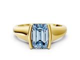 Yellow gold Fancy Blue Emerald Cut Solitaire Tension Set Diamond Ring with Split Shank Band