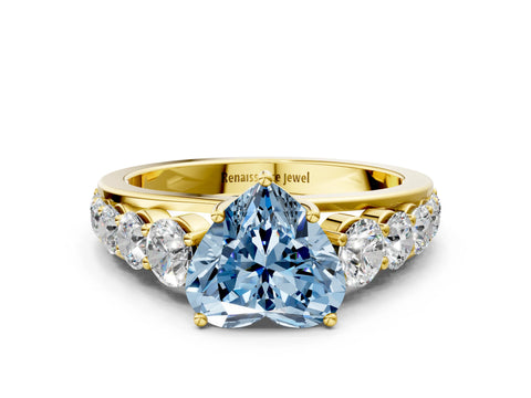 Yellow gold Fancy Blue Heart Cut Brilliant Diamond Pavé Band with Six-Prong Setting