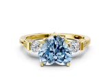 Yellow gold Fancy Blue Heart Cut Brilliant Three-Stone Pave Band with Four-Prong Setting