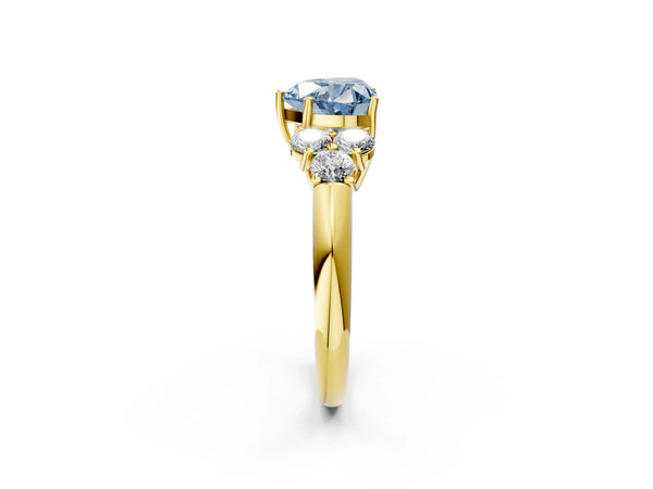 Yellow gold Fancy Blue Heart  Cut Diamond Cluster Ring with Round Accent Stones and Prong Setting on a Classic Band