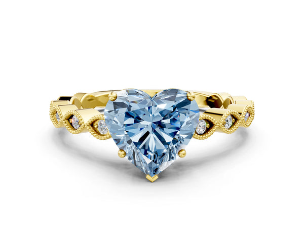 Yellow gold Fancy Blue Heart Cut Solitaire Diamond Ring with Infinity Twist Band and Four-Prong Setting