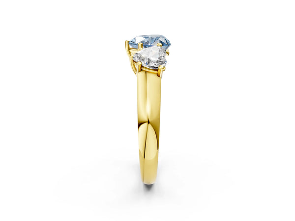 Yellow gold Fancy Blue Heart Cut Three-Stone Diamond Ring with Prong Setting on a Classic Band
