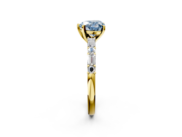 Yellow gold Fancy Blue Heart Cut Diamond Solitaire with Side Baguettes and Channel Set Band