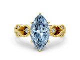 Yellow gold Fancy Blue Marquise Cut Solitaire Milgrain Leaf Band with Prong Setting