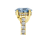 Yellow gold Fancy Blue Oval  Brilliant Diamond Solitaire with Pavé Band and Four-Prong Setting