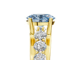 Yellow gold Fancy Blue Oval  Brilliant Solitaire with Side Stones on a Pave Band and Four-Prong Setting_29
