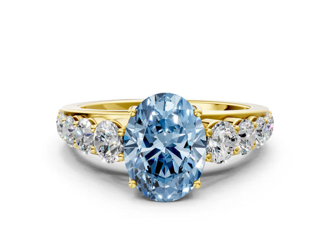 Yellow gold Fancy Blue Oval Cut Brilliant Diamond Pavé Band with Six-Prong Setting