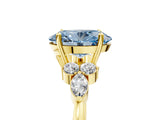 Yellow gold Fancy Blue Oval Cut Brilliant Diamond Solitaire Ring with Pear Side Stones and Four-Prong Setting_8