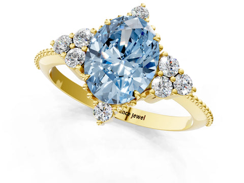 Yellow gold Fancy Blue Oval Cut Brilliant Diamond with Cluster Setting on a Beaded Band and Four-Prong Setting_1