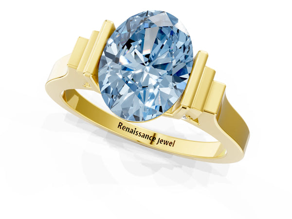 Yellow gold Fancy Blue Oval Cut Brilliant Solitaire Diamond Ring with Channel Set Band and Bar Prong Setting