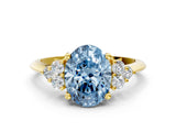 Yellow gold Fancy Blue Oval Cut Cut Diamond Cluster Ring with Solitaire Band and Four-Prong Setting