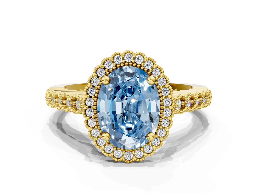 Yellow gold Fancy Blue Oval Cut Cut Halo Pavé Solitaire Ring with Milgrain Band
