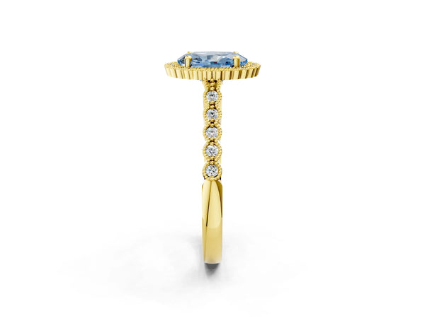 Yellow gold Fancy Blue Oval Cut Cut Halo Pavé Solitaire Ring with Milgrain Band