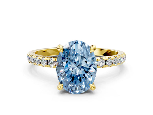 Yellow gold Fancy Blue Oval Cut Diamond Brilliant Solitaire Ring with Pavé Band and Four-Prong Setting