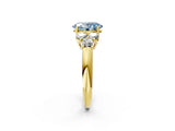 Yellow gold Fancy Blue Oval  Cut Diamond Cluster Ring with Round Accent Stones and Prong Setting on a Classic Band_51