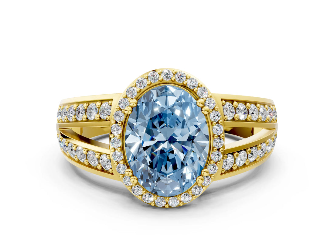 Yellow gold Fancy Blue Oval Cut Diamond Halo Ring with Split Shank Pavé Band and Four-Prong Setting