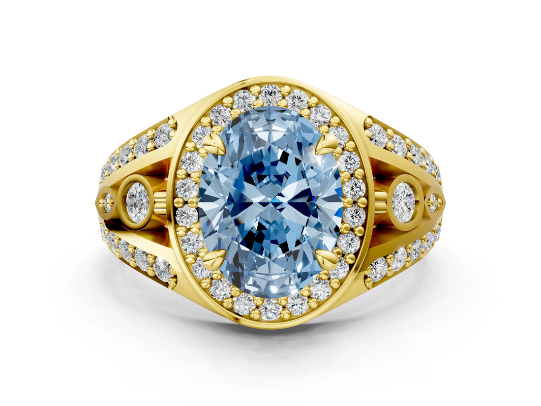 Yellow gold Fancy Blue Oval Cut Diamond Halo Ring with Split Shank and Bezel Accents and Four-Prong Setting