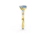 Yellow gold Fancy Blue Oval  Cut Diamond Ring with Baguette Side Stones, Channel Set Band, and Four-Prong Setting_26