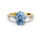 Yellow gold Fancy Blue Oval  Cut Diamond Ring with Baguette Side Stones, Channel Set Band, and Four-Prong Setting_3