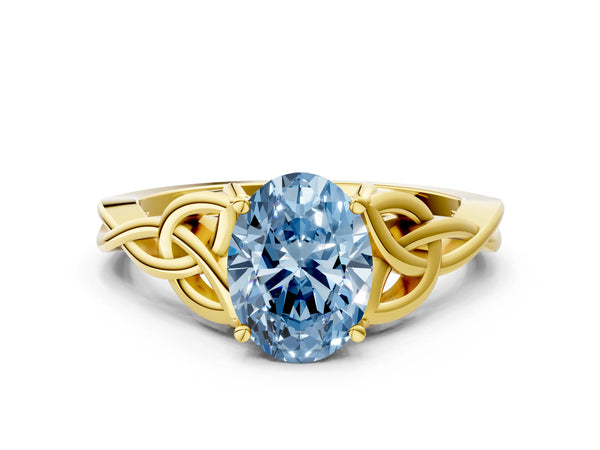 Yellow gold Fancy Blue Oval Cut Diamond Solitaire Celtic Knot Ring with Four-Prong Setting