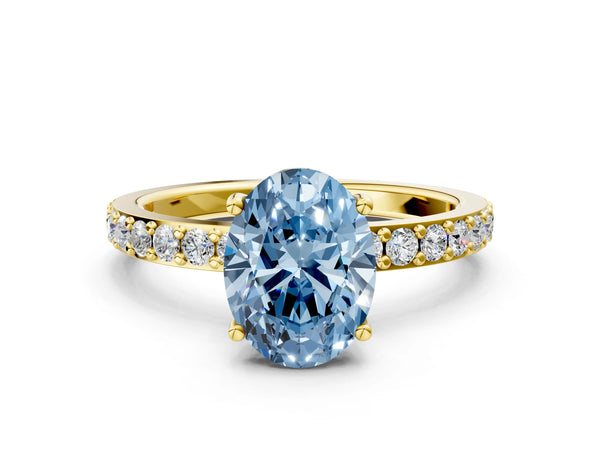 Yellow gold Fancy Blue Oval  Cut Diamond Solitaire with Pave Band and Four-Prong Setting