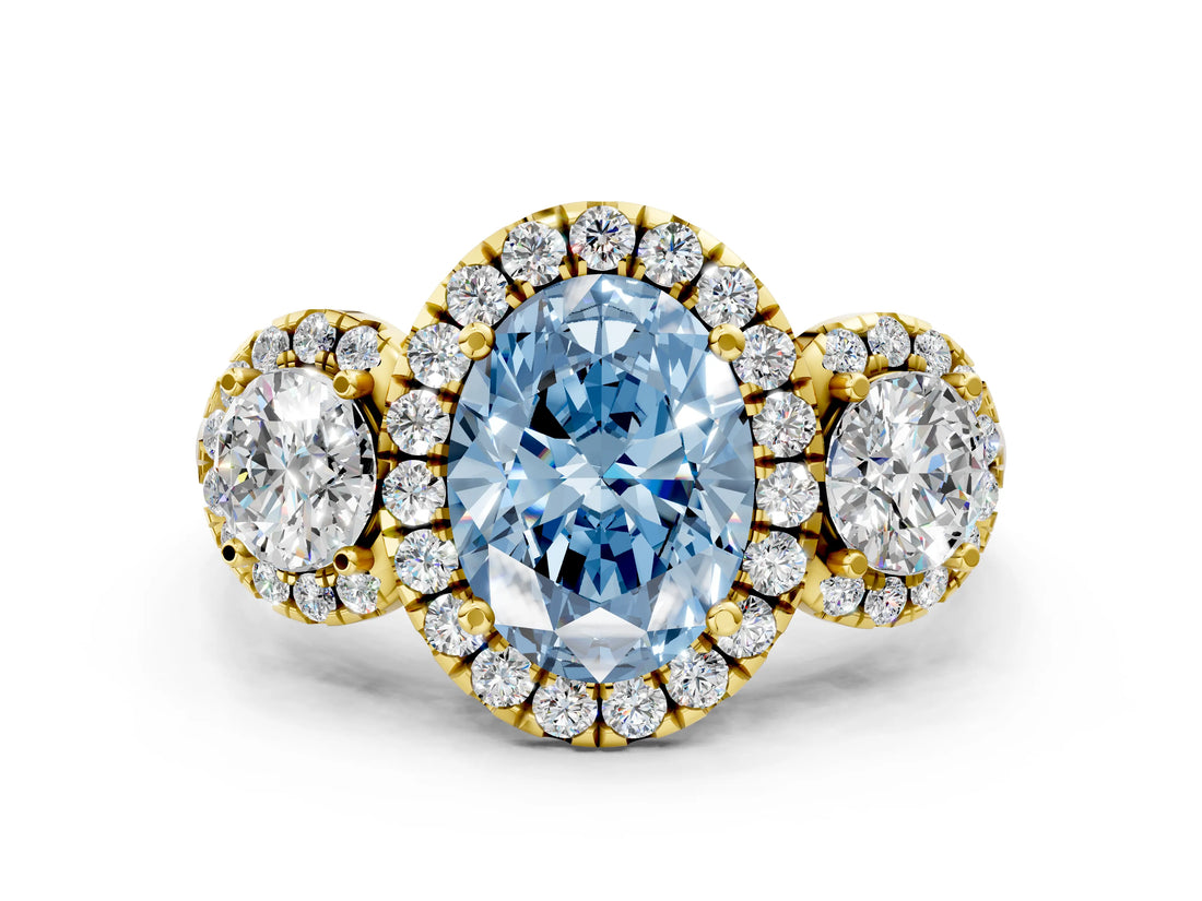 Yellow gold Fancy Blue Oval Cut Diamond Three-Stone Halo Ring with Prong Setting and Pavé Accents