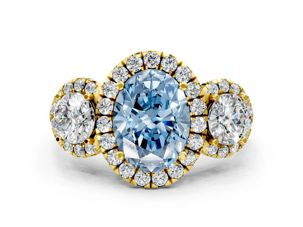 Yellow gold Fancy Blue Oval Cut Diamond Three-Stone Halo Ring with Prong Setting and Pavé Accents