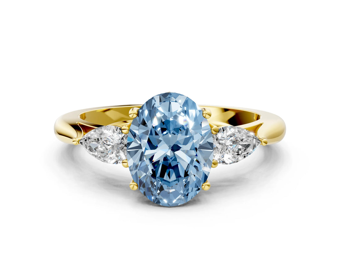 Yellow gold Fancy Blue Oval Cut Diamond Three-Stone Ring with Pear Side Stones and Four-Prong Setting_84