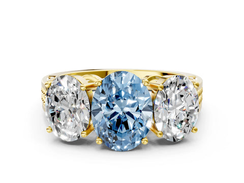 Yellow gold Fancy Blue Oval Cut Diamond Three-Stone Ring with Prong Setting and Textured Band