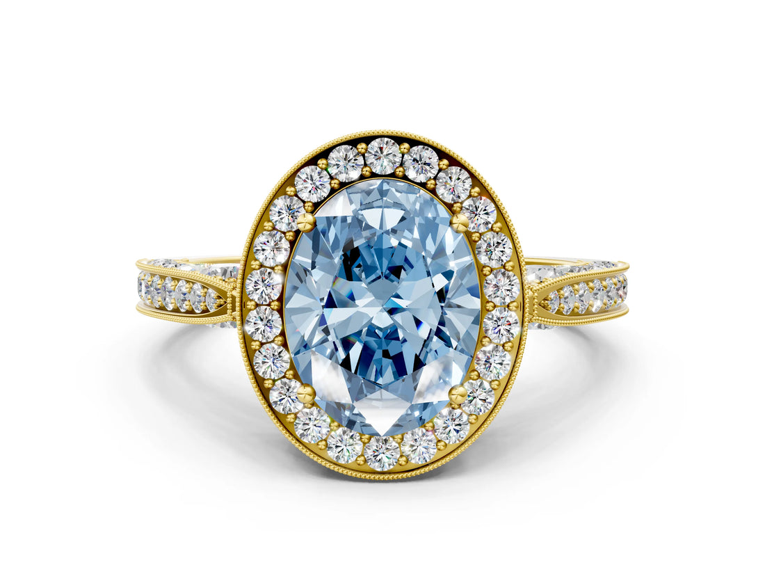 Yellow gold Fancy Blue Oval Cut Halo Diamond Engagement Ring with Split Shank Band and Four-Prong Setting