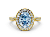 Yellow gold Fancy Blue Oval Cut Halo Diamond Engagement Ring with Split Shank Band and Four-Prong Setting