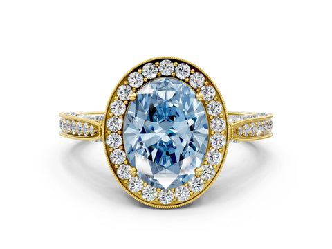 Yellow gold Fancy Blue Oval Cut Halo Diamond Engagement Ring with Split Shank Band and Four-Prong Setting