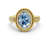 Yellow gold Fancy Blue Oval Cut Halo Diamond Ring with Beaded Split Shank and Four-Prong Setting