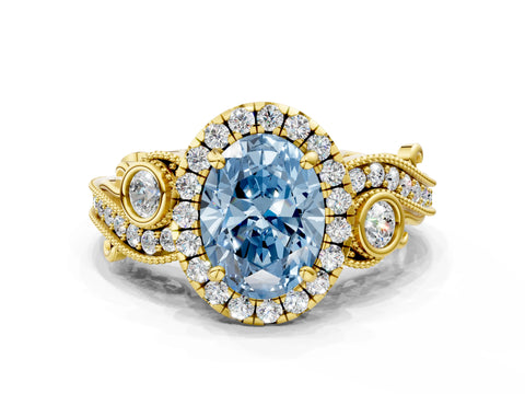 Yellow gold Fancy Blue Oval Cut Halo Diamond Ring with Milgrain and Bezel Accents on a Split Shank Band