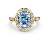 Yellow gold Fancy Blue Oval Cut Halo Diamond Ring with Pavé Band and Three-Prong Setting