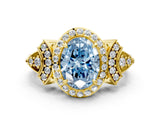 Yellow gold Fancy Blue Oval Cut Halo Diamond Split Shank Engagement Ring with Four-Prong Setting