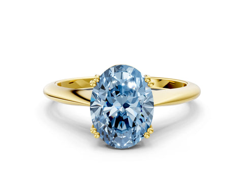 Yellow gold Fancy Blue Oval Cut Solitaire Diamond Ring with Six-Prong Setting and Classic Band