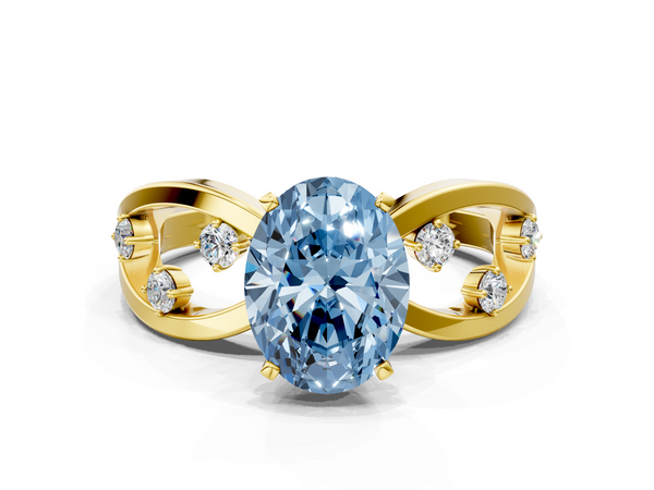 Yellow gold Fancy Blue Oval  Cut Solitaire Diamond with Side Stones on Criss-Cross Band and Four-Prong Setting