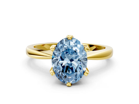 Yellow gold Fancy Blue Oval Cut Solitaire Engagement Ring with Six-Prong Setting and Tapered Band