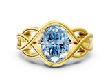 Yellow gold Fancy Blue Oval Cut Solitaire Intertwined Band Prong Setting Ring