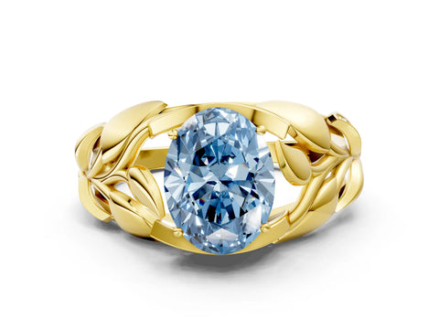 Yellow gold Fancy Blue Oval Cut Solitaire Leaf-Inspired Engagement Ring with Prong Setting