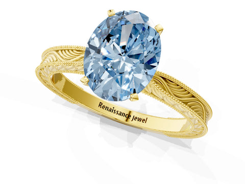 Yellow gold Fancy Blue Oval Cut Solitaire Milgrain Engraved Band with Four-Prong Setting_1
